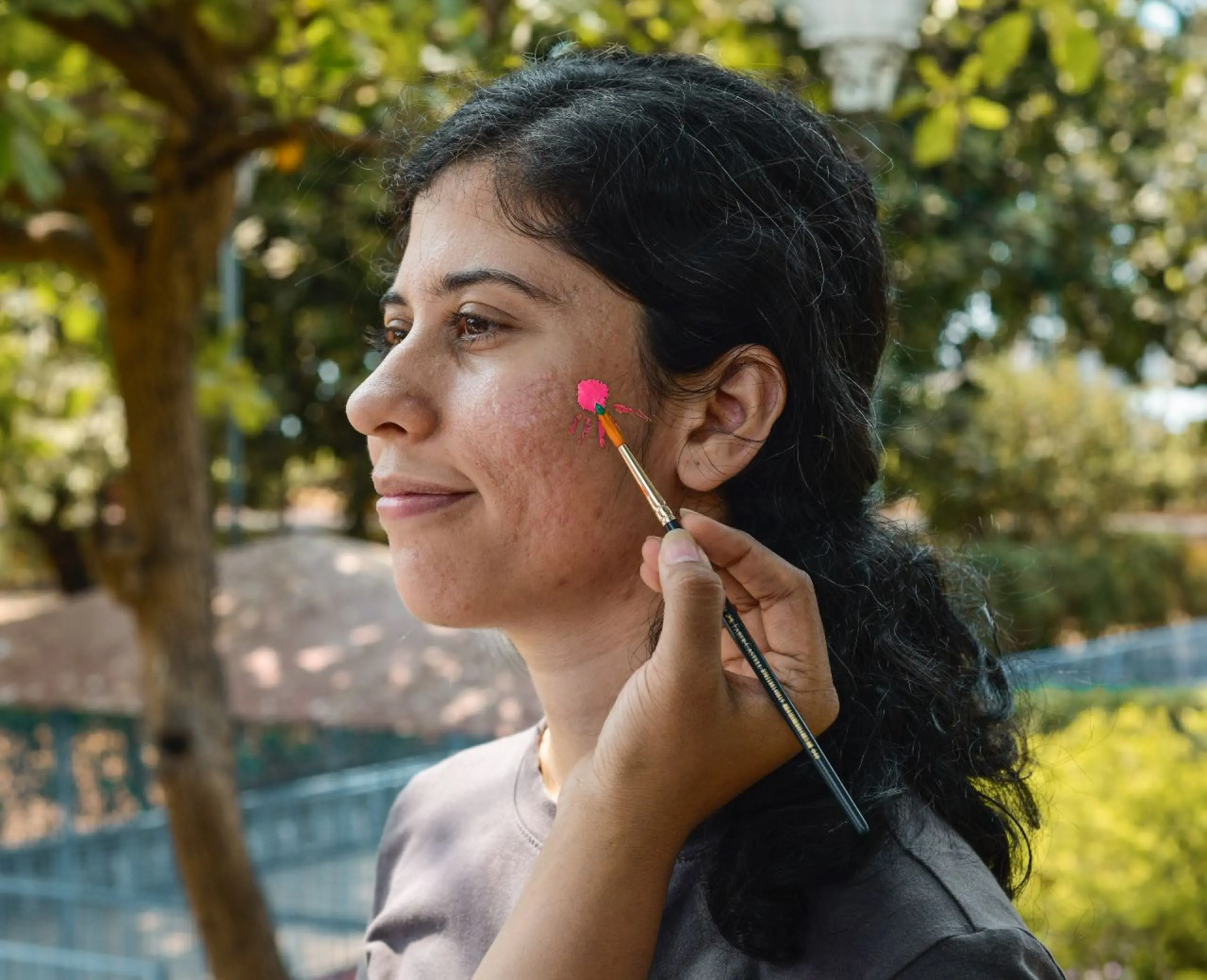 Team member getting face painted