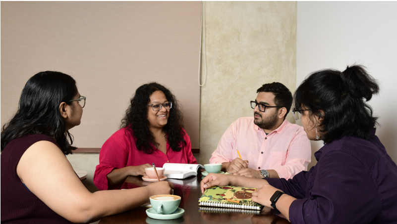 team members discussing and working together